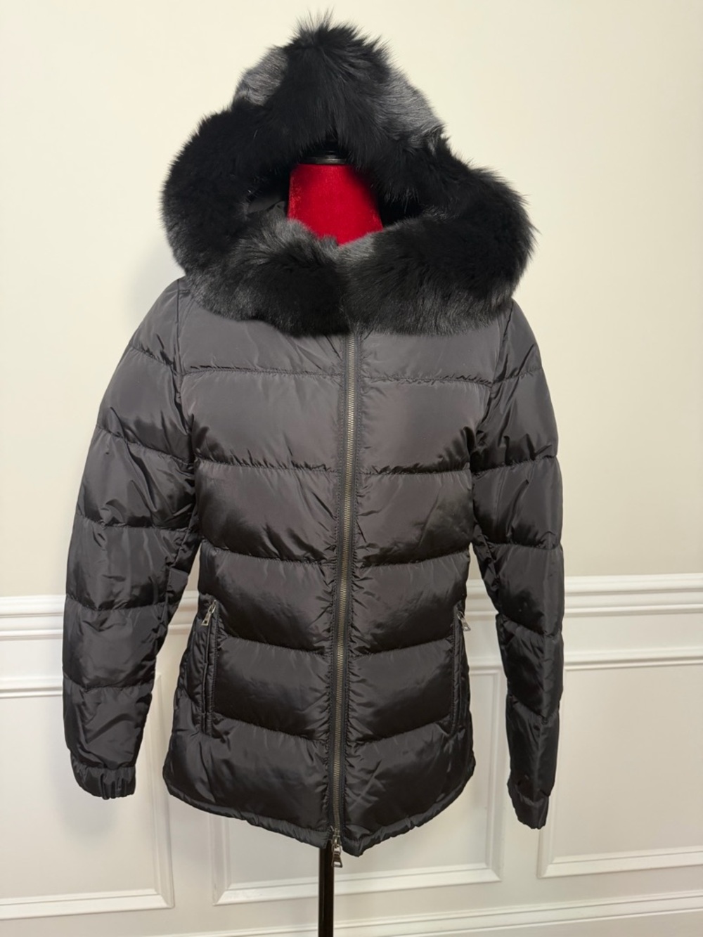 Prada 28A060 women's down puffer jacket in black, featuring a fur hood. New.